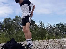 Cute twink Jon Arteen wears black Adidas outfit, shows his underwear, walks freeballing, jerking off throught his short shorts, cumming outdoor