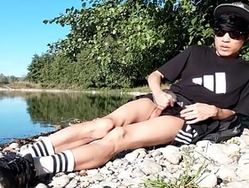 Jon Arteen wanks outdoor on a pebbles beach, the sexy twink wearing short shorts cums on his thigh, and cumplay