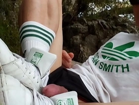 Caught making a porn video, Jon Arteen hides to film the masturbation and cum shot scene on his Adidas Stan Smith sneakers outside on a muddy riverbank