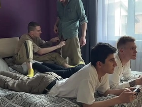 Stepfather and stepson fuck twinks in their tight asses while they play the console
